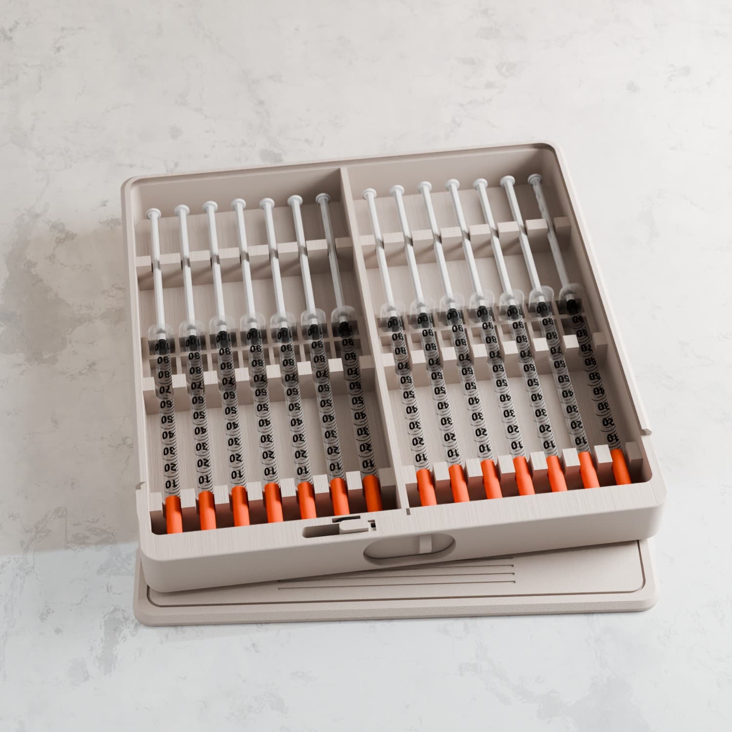 Open organizer case with vials and syringes