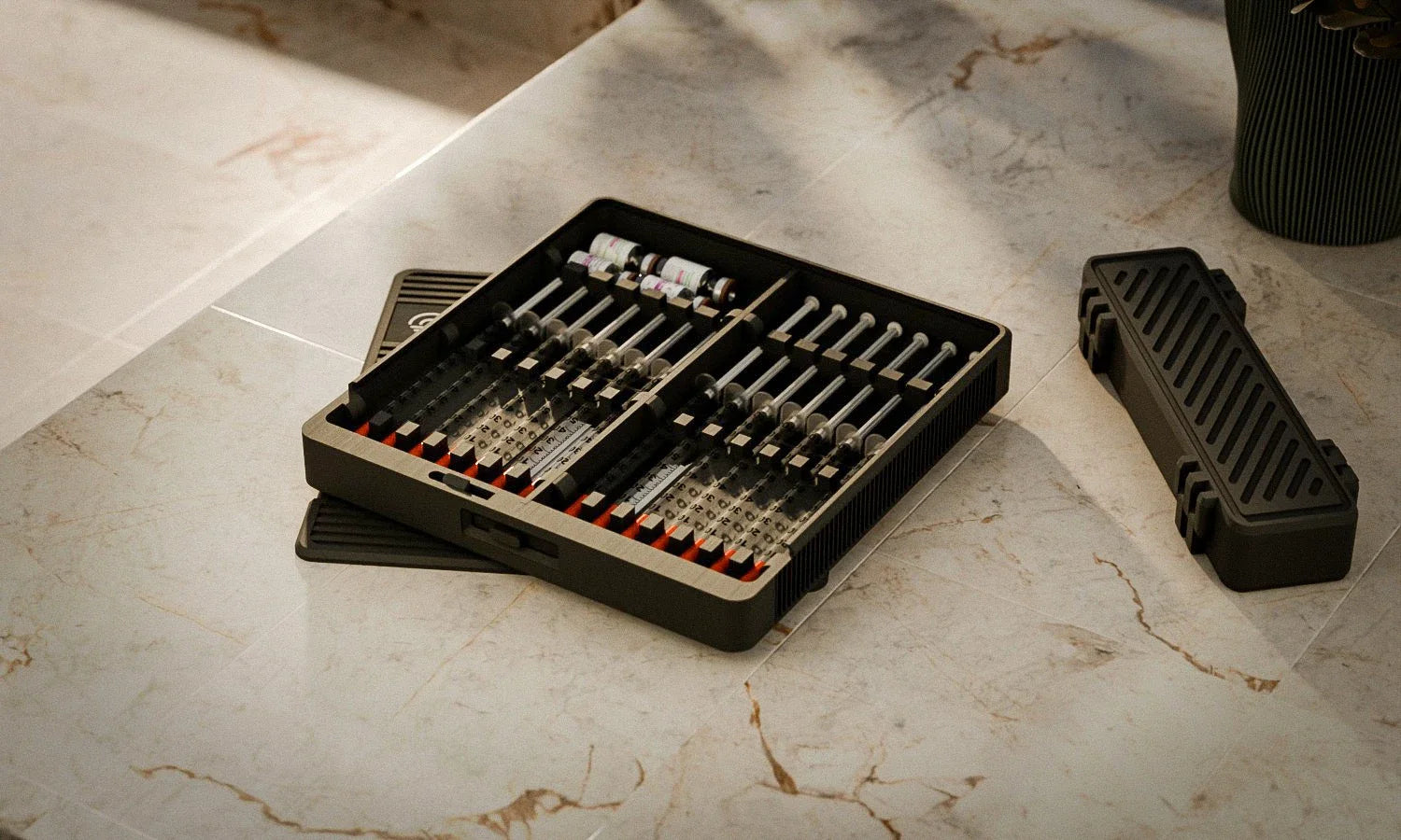 Open Routine Box and travel case on a sunlit marble counter